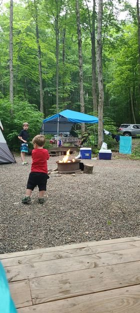 Family hanging out at Triple R in tent sites