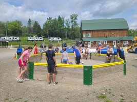 Kids playing in the gaga ball pit at Triple R