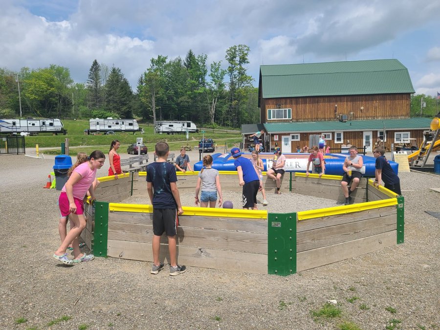 Kids playing in the gaga ball pit at Triple R