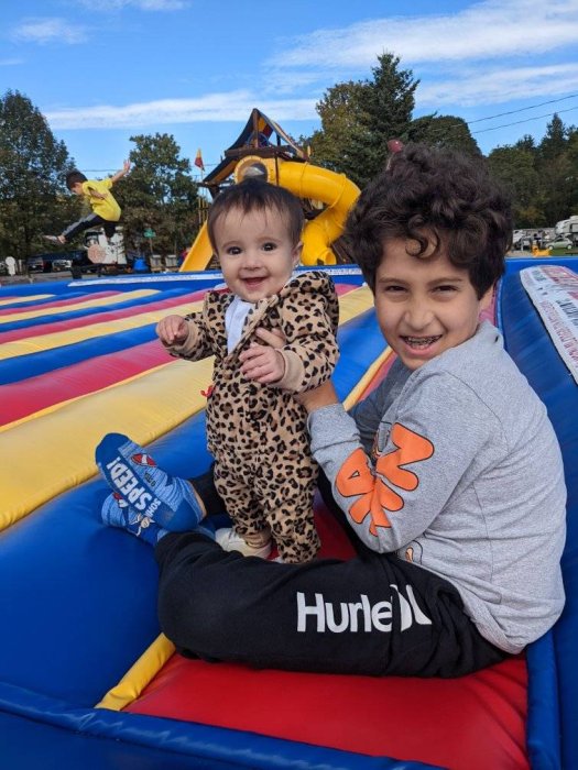 Kids playing on the jumping pad at Triple R