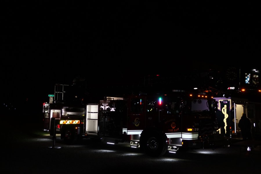 Fire truck lit up at night