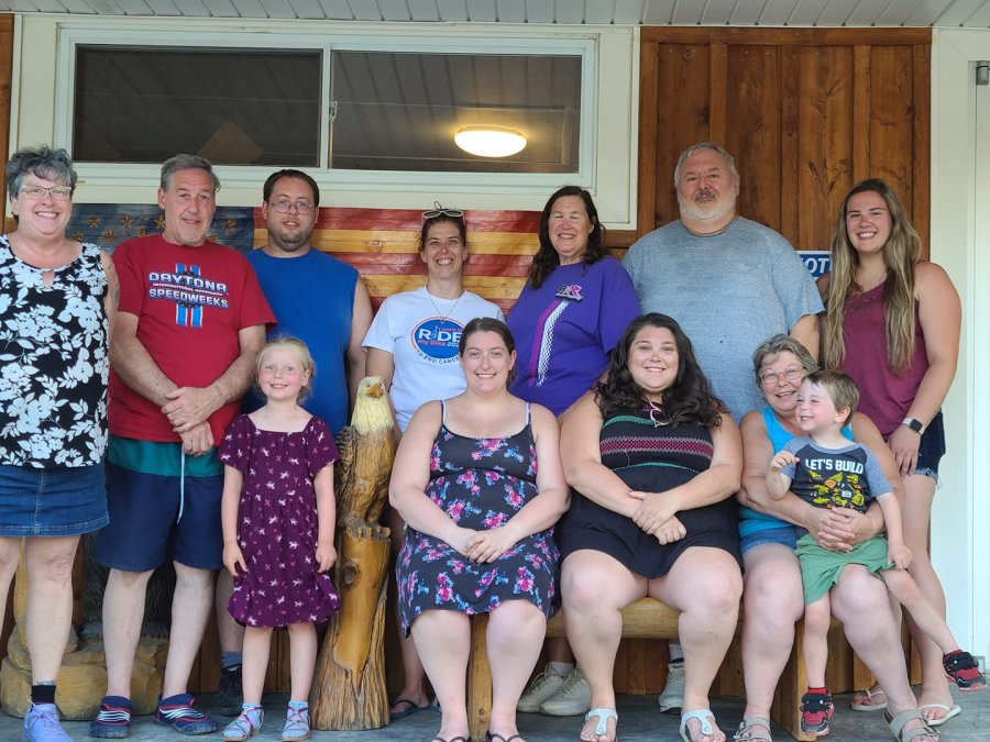 Family on selfie bench at Triple R