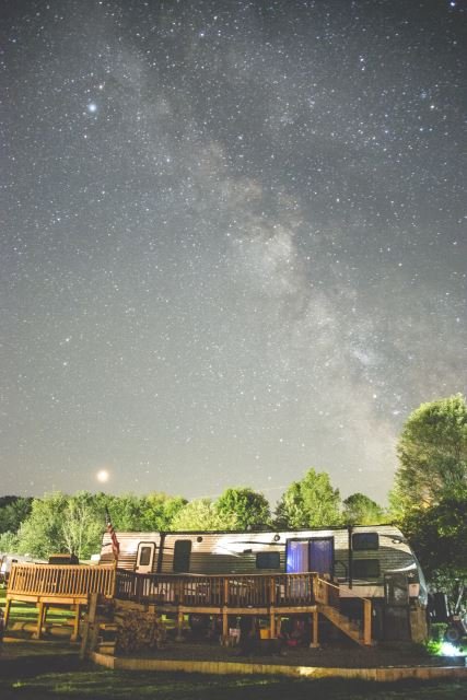 View of camp sites at night at Triple R Campground in Western NY