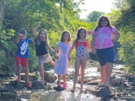 Kids playing in the creek at Triple R