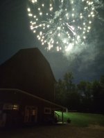 Fireworks over barn at Triple R July 4th