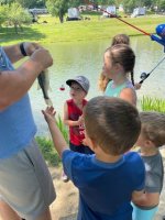 Kids fishing at the pond at Triple R