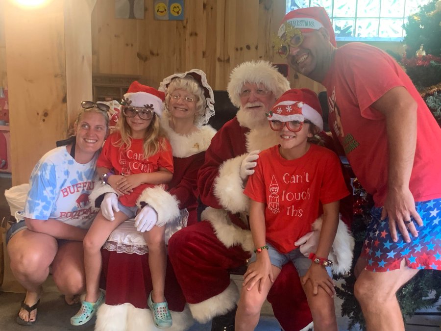 Family time with Santa and Mrs Clause on the selfie bench at Triple R