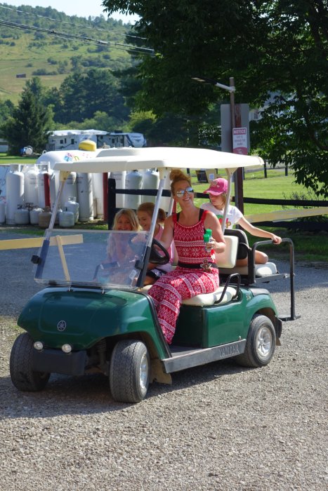 people in a golf cart