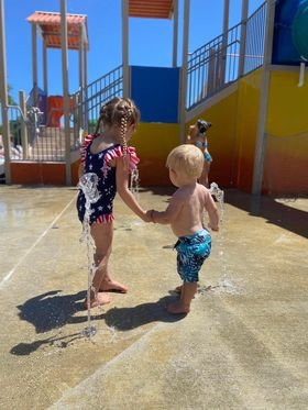 Kids playing in the LeeKee Lagoon at Triple R