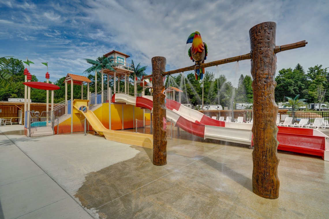 Spray pad slides and water curtain at Triple R Camping Resort, a private campground in Western NY